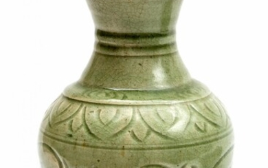 A carved celadon glaze vase