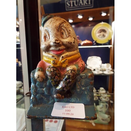 A cast iron novelty money box in the form of humpty dumpty