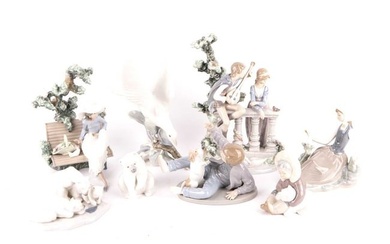 A collection of eight Lladro figurines comprising Sunday in the park, the serenade, a boy with dog