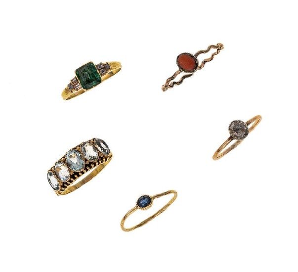 AMENDMENT Please note that the emerald and diamond ring is set with a foiled paste and not an emerald as stated in the online catalogue. A collection of five gem-set antique rings, 19th century
