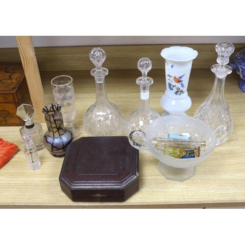 A collection of glass perfume bottles, three decanters, two ...