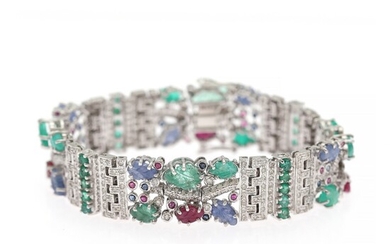 A diamond bracelet set with numerous brilliant-cut diamonds flanked by sapphires, emeralds and rubies, mounted in 14k white gold. L. app. 18.8 cm.