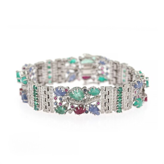 A diamond bracelet set with numerous brilliant-cut diamonds flanked by sapphires, emeralds and rubies, mounted in 14k white gold. L. app. 18.8 cm.