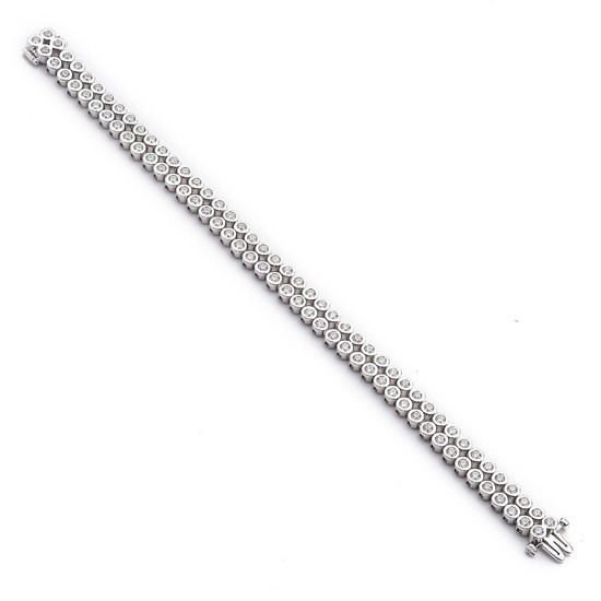 A diamond bracelet set with numerous brilliant-cut diamonds weighing a total of app. 4.88 ct., mounted in 18k white gold. H/VVS-VS. Triple excellent-cut.