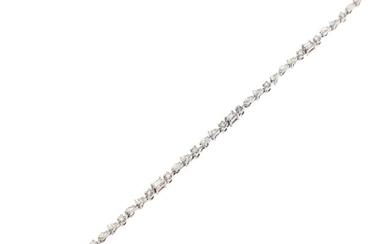 A diamond bracelet set with numerous brilliant, navette and baguette-cut and pear- shaped diamonds totalling app. 2.85 ct., mounted in 14k white gold.