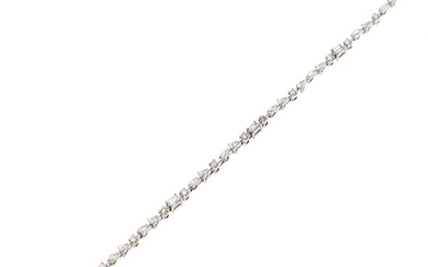 NOT SOLD. A diamond bracelet set with numerous brilliant, navette and baguette-cut and pear-shaped diamonds...