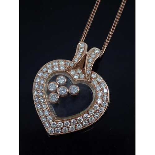 A diamond set 18ct gold heart pendant (happy diamonds style)...