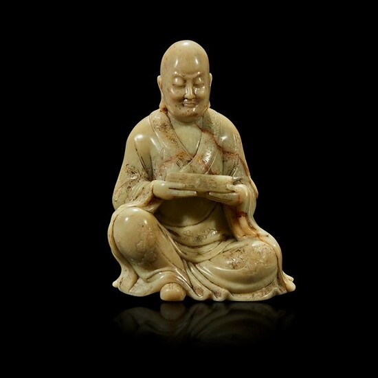 A finely-carved Chinese soapstone figure of a luohan