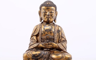A gilt bronze statue of Gautama Buddha