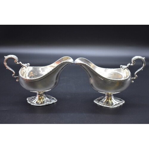 A good pair of George III cast silver sauce boats, by W B (p...