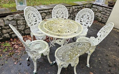 A good pierced Metal Patio Set consisting of a table with pi...