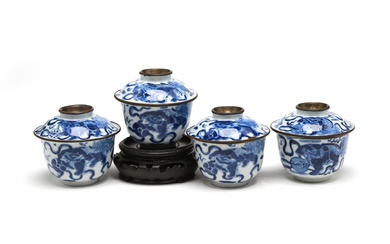 A group of blue and white porcelain Jibo covered teacups painted with Buddhist lions playing with brocade balls
