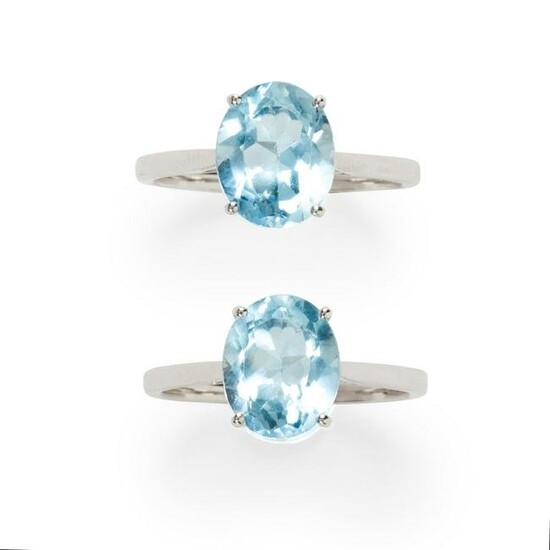 A group of blue topaz and fourteen karat white gold
