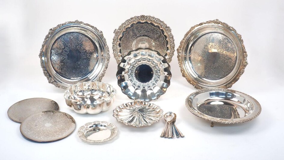 A group of silver plated bowls, trays and dishes including a circular flowerhead-design German bowl and a similarly shaped circular dish; two place mats; a salver raised on three bracket feet and a shell-design plate(a lot)