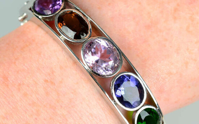 A hinged bangle, with amethyst, morganite, iolite and further collet-set gems.