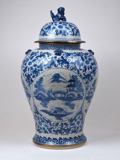 A large Chinese blue and white baluster vase and cover, 20th century, the body decorated with pagodas in landscape settings, 60cm high