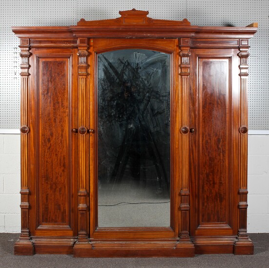 A large Victorian mahogany wardrobe-linen press, of architectural breakfront form