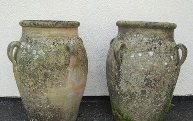 A large pair of weathered terracotta planters of tapering ba...