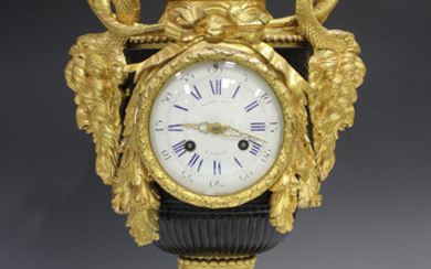 A late 19th century French ormolu, black patinated and white marble mantel clock, the eight day move