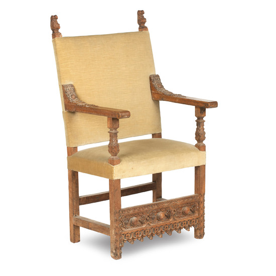A late 19th century walnut framed and upholstered oversized chair, in the Carolean style