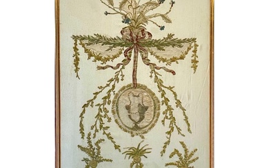 A late George III silk work panel. With a central urn medall...