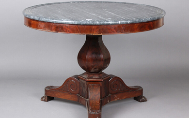 A mid-19th century French mahogany circular centre table with grey marble top, raised on a baluster