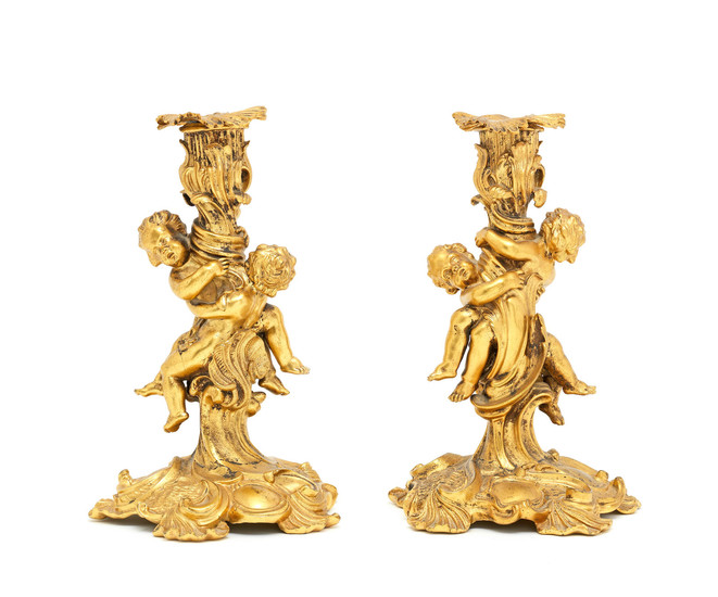 A pair of 19th century French gilt bronze figural candlesticks