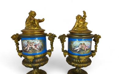 A pair of 19th century French gilt bronze mounted Sevres sty...