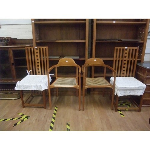 A pair of 20th Century teak high-back dining chairs, after G...