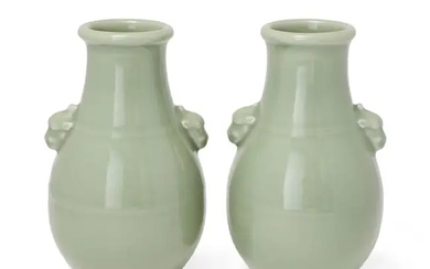 A pair of Chinese celadon-glazed pear-shaped vases with mythical beast handles, Republic...