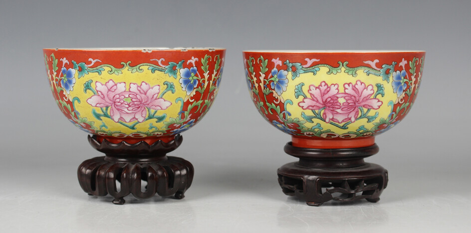A pair of Chinese coral-ground famille rose porcelain bowls, mark and period of Qianlong, each of st