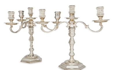 A pair of Elizabeth II silver four light candelabra, London, c.1977, A Haviland-Nye, the knopped stems to stepped hexagonal feet and detachable triple branch sections, the capitals and drip pans also of hexagonal form, 29cm high, total weight...