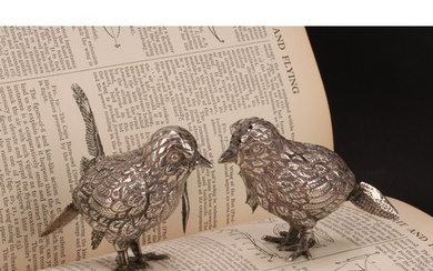 A pair of Elizabeth II silver novelty peppers, cast as birds...