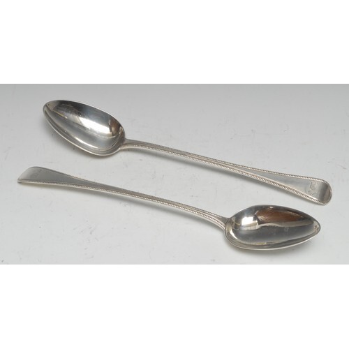 A pair of George III Old English bead pattern basting spoons...