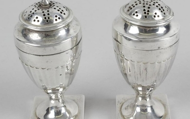 A pair of George III small silver casters, each of vase