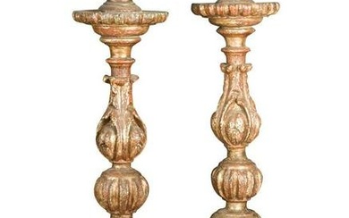 A pair of Italian carved wood, gesso and silvered altar candlesticks, 18th/19th century