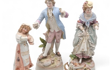 A pair of Meissen style figures in 18th century dress, toget...