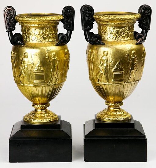 A pair of Neoclassical style gilt bronze urns