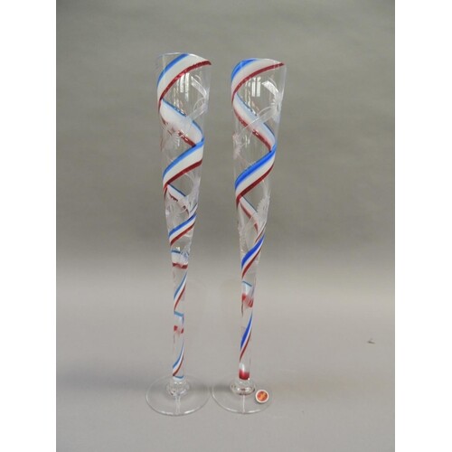 A pair of Royal Brierley Millenium champagne flutes, the cle...