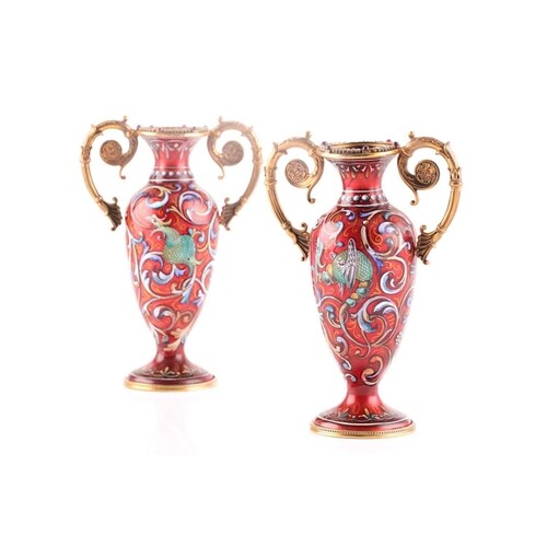 A pair of Russian enamel silver gilt vases, the rims set wit...