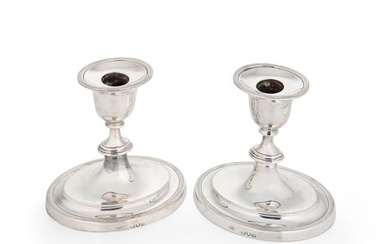 A pair of Victorian silver library candlesticks