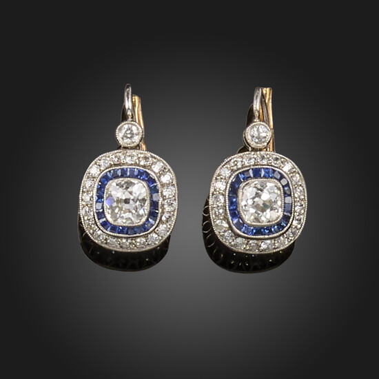 A pair of diamond and sapphire cluster drop earrings