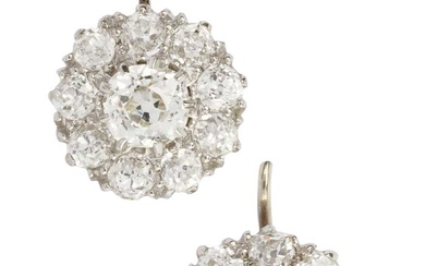 A pair of diamond cluster earrings, the central old cut...