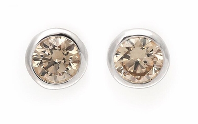 SOLD. A pair of diamond ear studs each set with a brilliant-cut Fancy Brown diamond weighing a total of app. 0.52 ct., mounted in 18k white gold. (2) – Bruun Rasmussen Auctioneers of Fine Art
