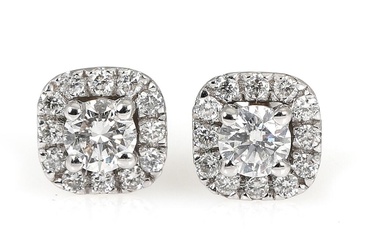 A pair of diamond ear studs each set with numerous brilliant-cut diamonds...