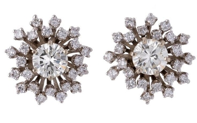 A pair of diamond ear studs, of cluster design, each centring on a brilliant-cut diamonds, within a removeable cluster surround of brilliant-cut diamonds, post fittings