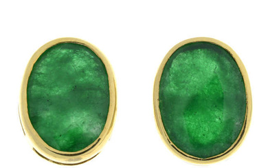 A pair of emerald single-stone stud earrings.