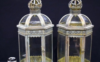 A pair of metal and glass lanterns 62 cm.(2)
