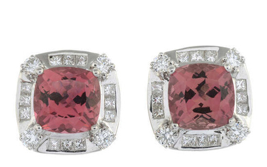 A pair of orangish-pink tourmaline and vari-cut diamond cluster earrings.