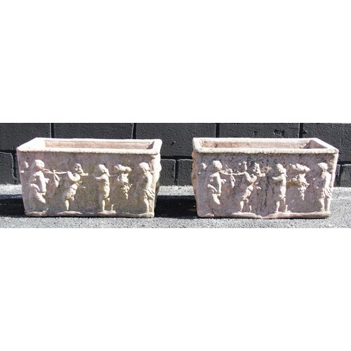 A pair of reconstituted stone planters, each of rectangular ...